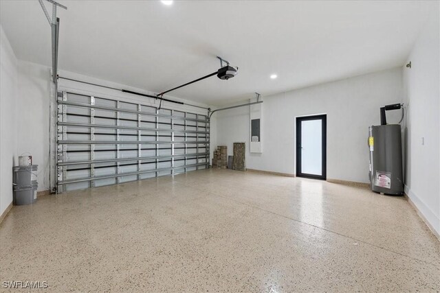 garage featuring water heater, baseboards, a garage door opener, and electric panel