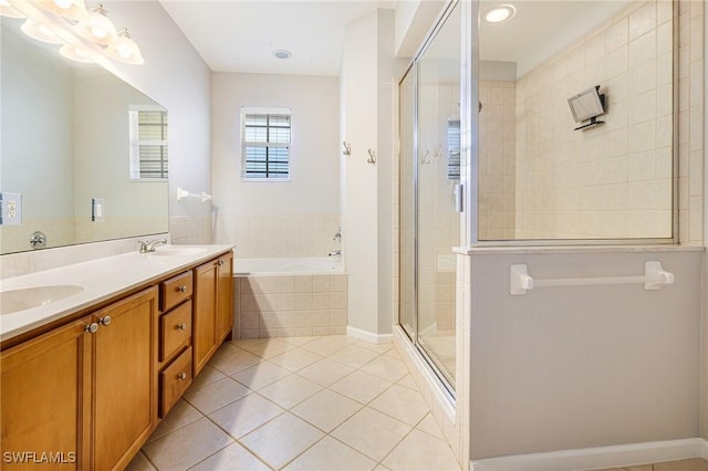 bathroom with tile patterned floors, a shower stall, a bath, double vanity, and a chandelier