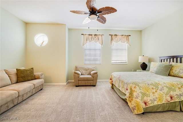 bedroom with carpet floors, baseboards, and a ceiling fan