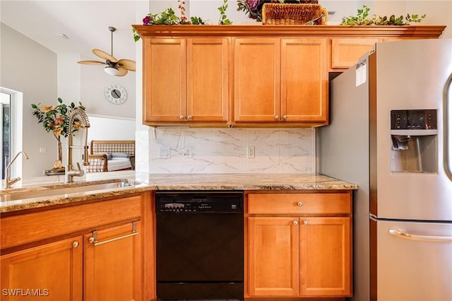 kitchen with dishwasher, refrigerator with ice dispenser, backsplash, a sink, and light stone counters