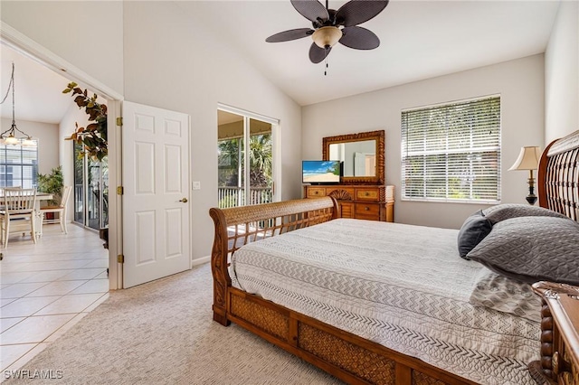 bedroom with multiple windows, access to outside, light tile patterned flooring, a ceiling fan, and high vaulted ceiling
