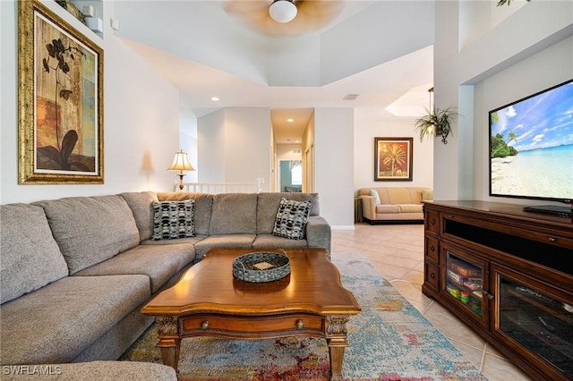 living area with light tile patterned floors, ceiling fan, and recessed lighting