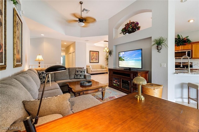 living room featuring ceiling fan and recessed lighting