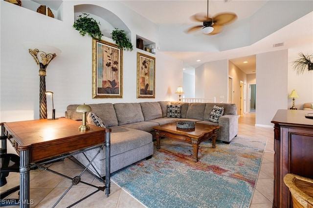 living area featuring light tile patterned floors, ceiling fan, and recessed lighting