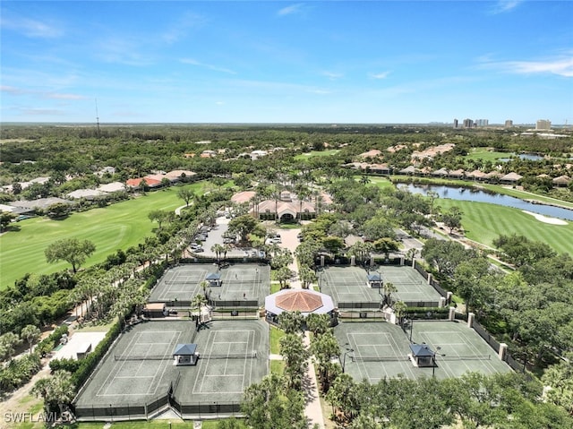 aerial view of residential area with a local golf course and a large body of water