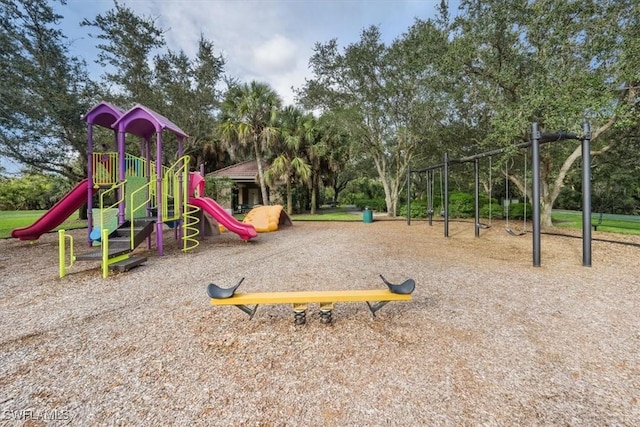 community playground featuring view of wooded area