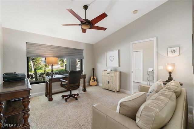 carpeted office featuring baseboards, ceiling fan, and vaulted ceiling