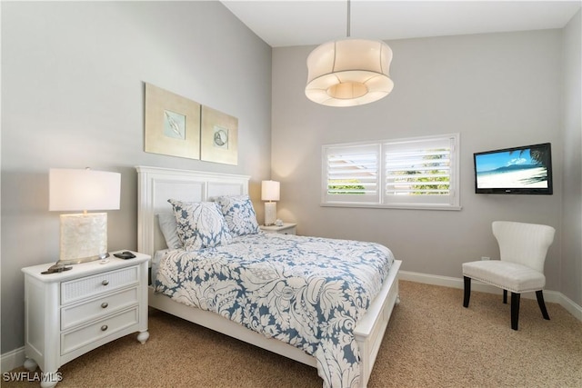 bedroom with baseboards and carpet flooring