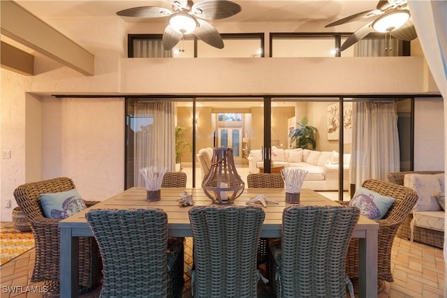 exterior space with a ceiling fan and an outdoor living space