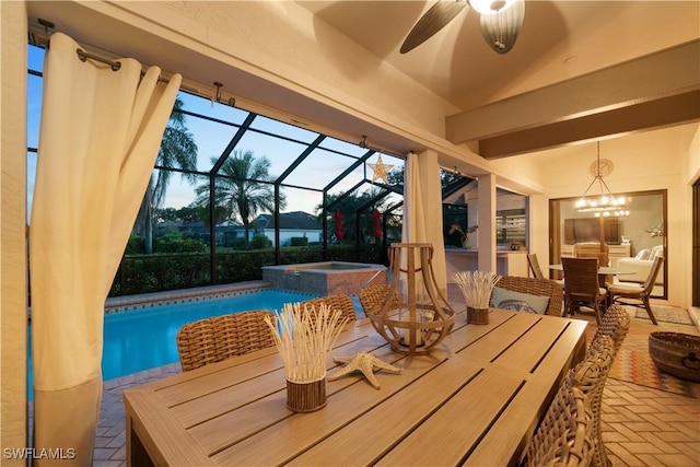 exterior space with an outdoor pool, outdoor dining area, glass enclosure, ceiling fan, and an in ground hot tub