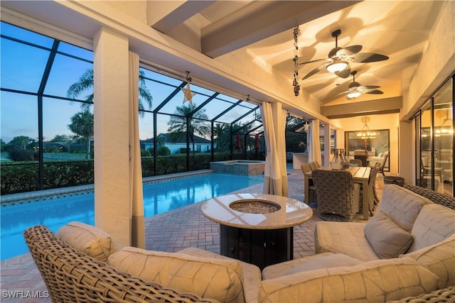 view of swimming pool featuring glass enclosure, ceiling fan, an outdoor hangout area, and a patio