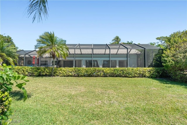 view of yard featuring glass enclosure