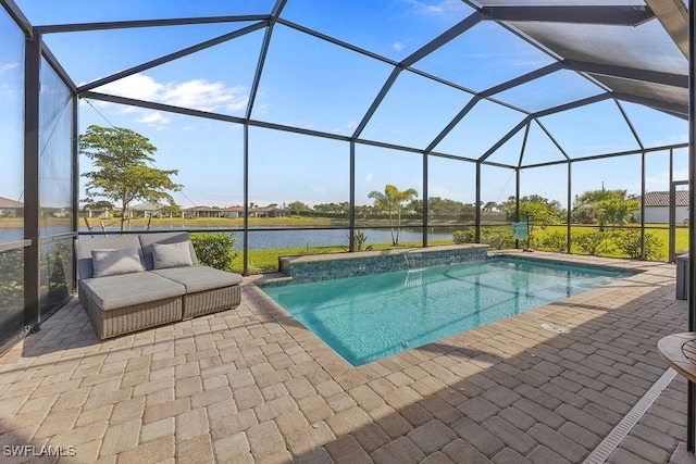 outdoor pool featuring glass enclosure, a water view, and a patio area