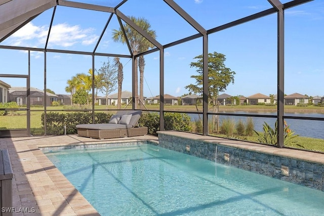 pool featuring a lanai, a patio area, a water view, and a residential view