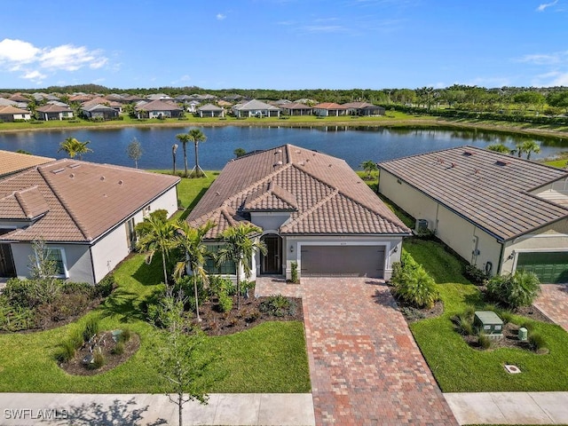 aerial view with a residential view and a water view