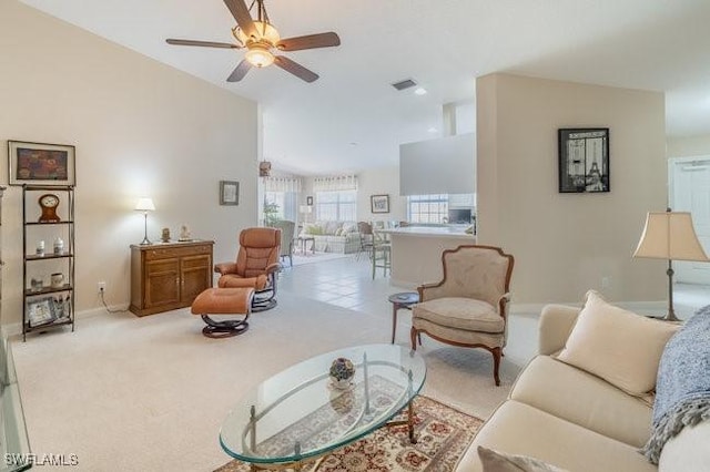 7520 Firenze Ln, Naples, FL 34114 - living room with visible vents, baseboards, ceiling fan, carpet floors, and high vaulted ceiling