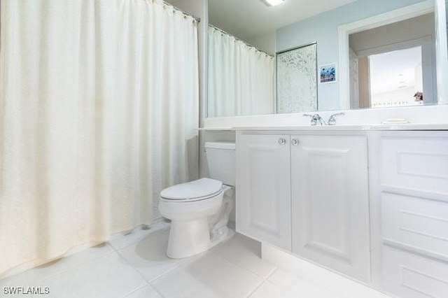 7520 Firenze Ln, Naples, FL 34114 - full bath featuring vanity, tile patterned floors, and toilet