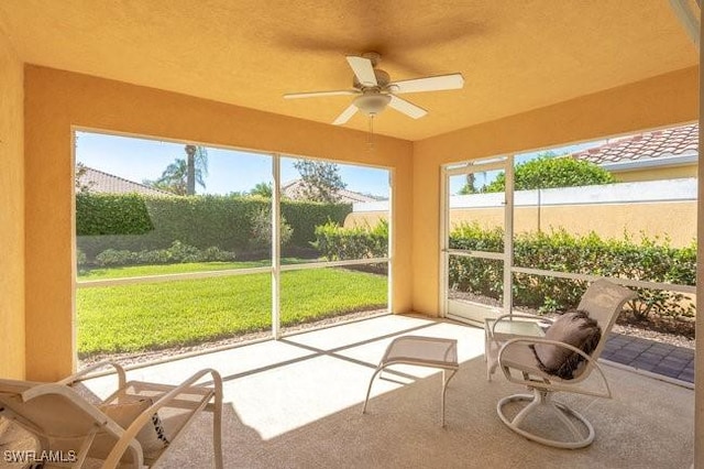 7520 Firenze Ln, Naples, FL 34114 - sunroom / solarium featuring a ceiling fan and a healthy amount of sunlight