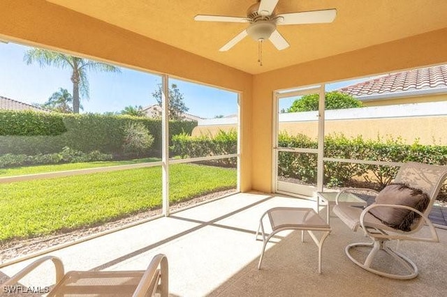 7520 Firenze Ln, Naples, FL 34114 - sunroom featuring a ceiling fan