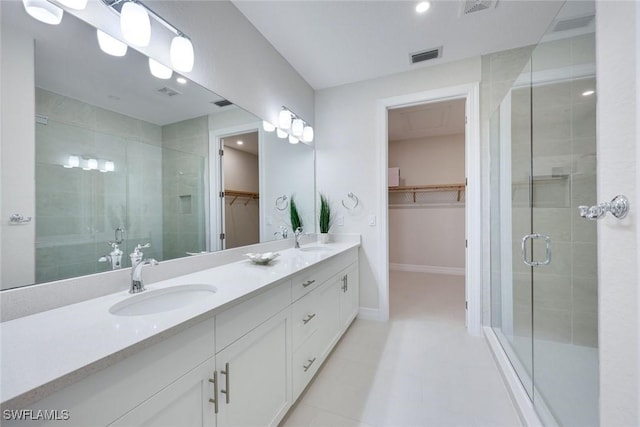 bathroom featuring a sink, visible vents, double vanity, and a shower stall