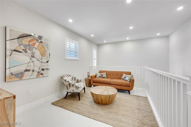 sitting room with recessed lighting and baseboards