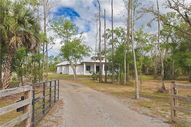 19401 Witts End, Alva, FL 33920 - view of front facade featuring fence and dirt driveway