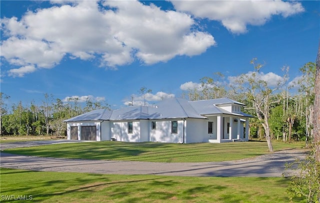 19401 Witts End, Alva, FL 33920 - view of front of property featuring asphalt driveway, a garage, a front lawn, and stucco siding