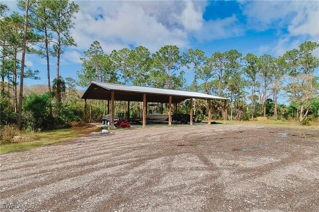 19401 Witts End, Alva, FL 33920 - view of community with a carport and dirt driveway