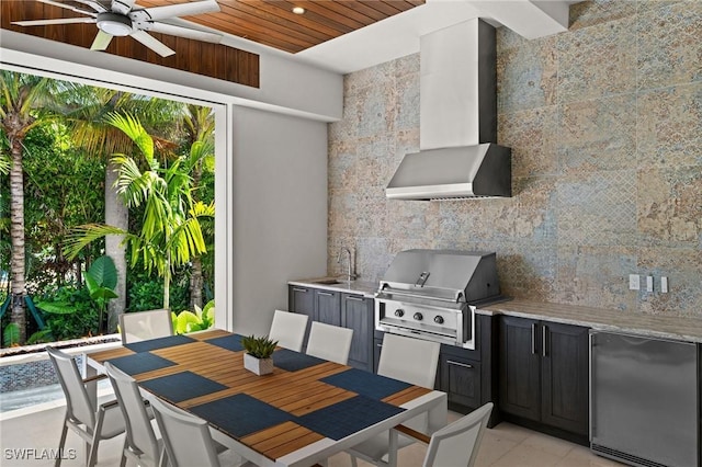 view of patio / terrace with outdoor dining space, area for grilling, ceiling fan, and a sink