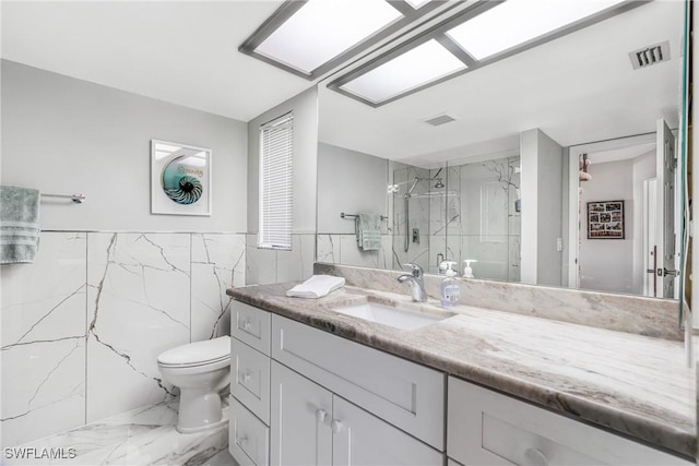 full bath with visible vents, marble finish floor, a marble finish shower, toilet, and vanity
