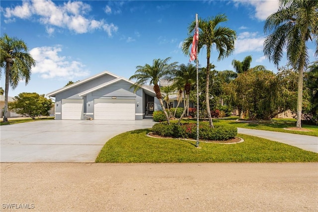 view of front of property featuring stucco siding, an attached garage, a front lawn, and concrete driveway