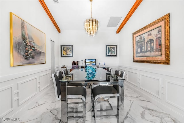 dining room with marble finish floor, visible vents, a decorative wall, a notable chandelier, and wainscoting