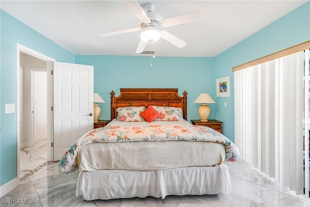 bedroom with marble finish floor, baseboards, and ceiling fan