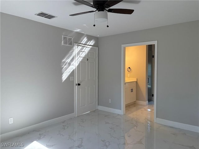 4430 18th Ave NE, Naples, FL 34120 - unfurnished bedroom featuring visible vents, marble finish floor, and baseboards