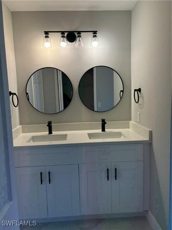 4430 18th Ave NE, Naples, FL 34120 - full bathroom with double vanity and a sink