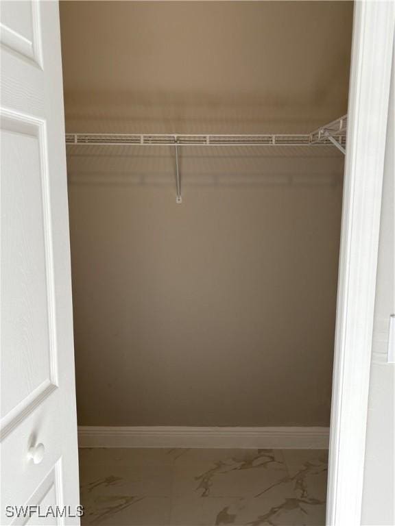 4430 18th Ave NE, Naples, FL 34120 - spacious closet featuring marble finish floor