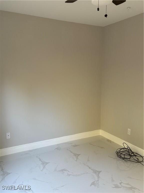 4430 18th Ave NE, Naples, FL 34120 - spare room featuring a ceiling fan, baseboards, and marble finish floor