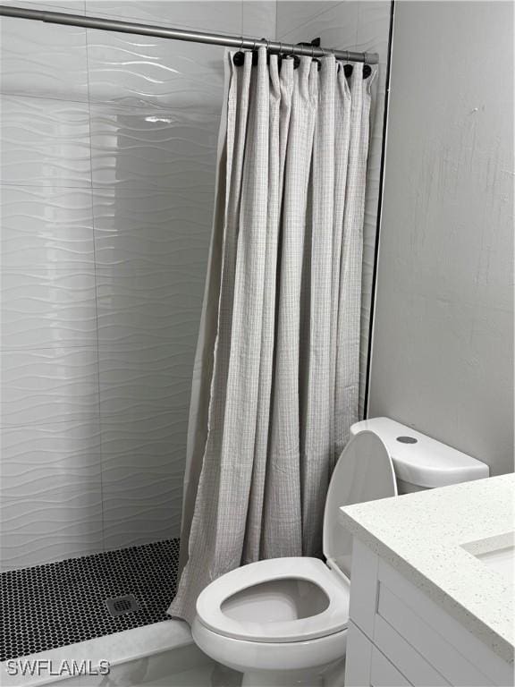 4430 18th Ave NE, Naples, FL 34120 - full bath featuring toilet, vanity, and a tile shower
