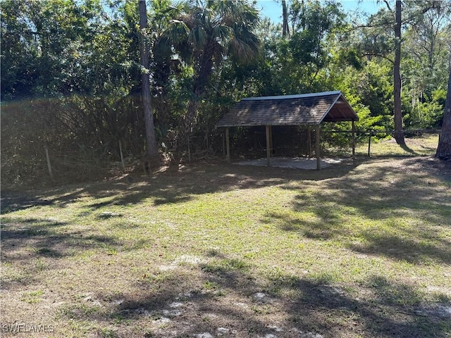 4430 18th Ave NE, Naples, FL 34120 - view of yard with a detached carport and fence