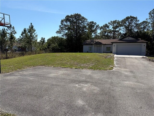 4430 18th Ave NE, Naples, FL 34120 - exterior space with a garage, driveway, and fence