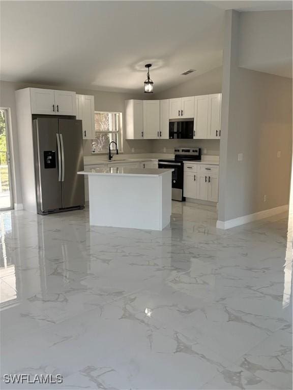 4430 18th Ave NE, Naples, FL 34120 - kitchen featuring a center island, light countertops, appliances with stainless steel finishes, white cabinetry, and a sink