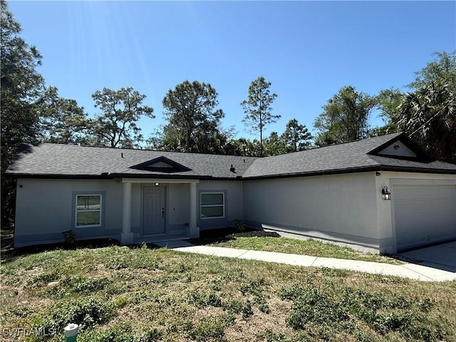 4430 18th Ave NE, Naples, FL 34120 - single story home with a shingled roof, a front lawn, concrete driveway, stucco siding, and an attached garage