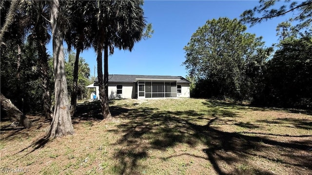 4430 18th Ave NE, Naples, FL 34120 - view of yard with a sunroom