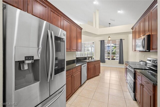 9954 Alabama St, Bonita Springs, FL 34135 - kitchen featuring decorative light fixtures, a sink, recessed lighting, appliances with stainless steel finishes, and light tile patterned floors