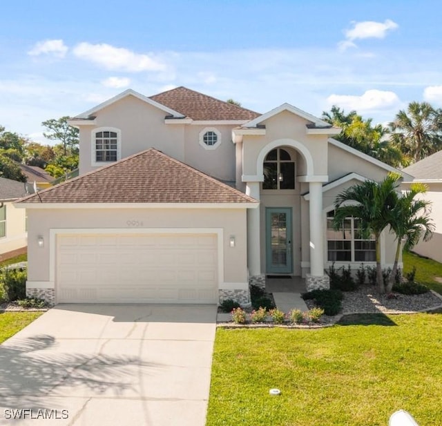 9954 Alabama St, Bonita Springs, FL 34135 - mediterranean / spanish home featuring a shingled roof, a front lawn, stucco siding, a garage, and driveway