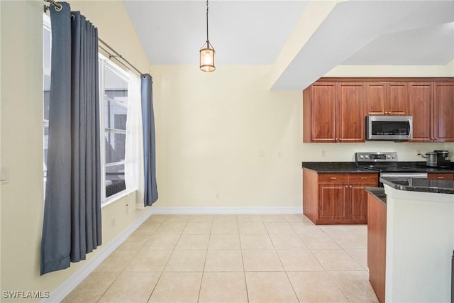 9954 Alabama St, Bonita Springs, FL 34135 - kitchen with baseboards, lofted ceiling, light tile patterned floors, appliances with stainless steel finishes, and hanging light fixtures