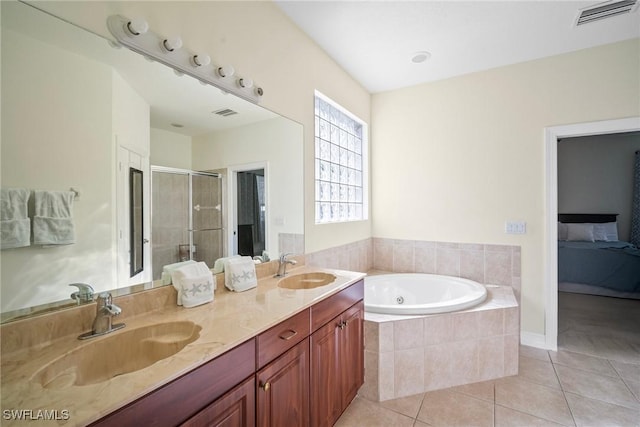 9954 Alabama St, Bonita Springs, FL 34135 - ensuite bathroom with visible vents, a garden tub, a stall shower, a sink, and tile patterned flooring