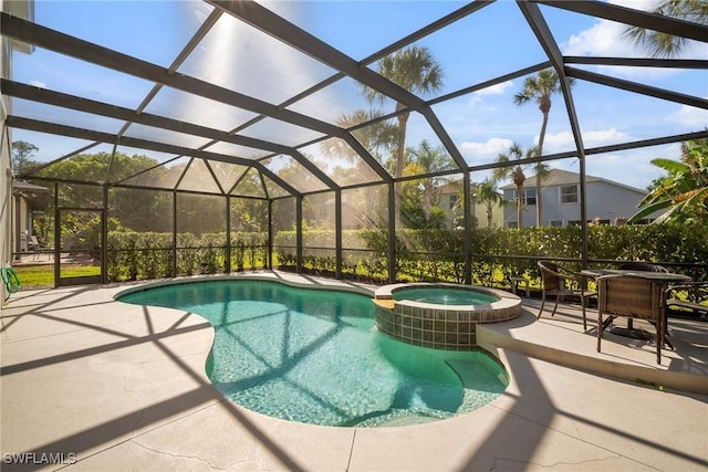 9954 Alabama St, Bonita Springs, FL 34135 - view of pool featuring glass enclosure, a pool with connected hot tub, and a patio