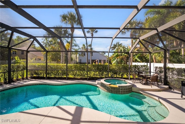 9954 Alabama St, Bonita Springs, FL 34135 - view of swimming pool with glass enclosure, a pool with connected hot tub, and a patio area