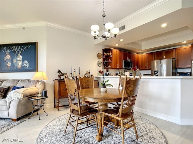 dining area featuring visible vents, an inviting chandelier, a tray ceiling, recessed lighting, and crown molding